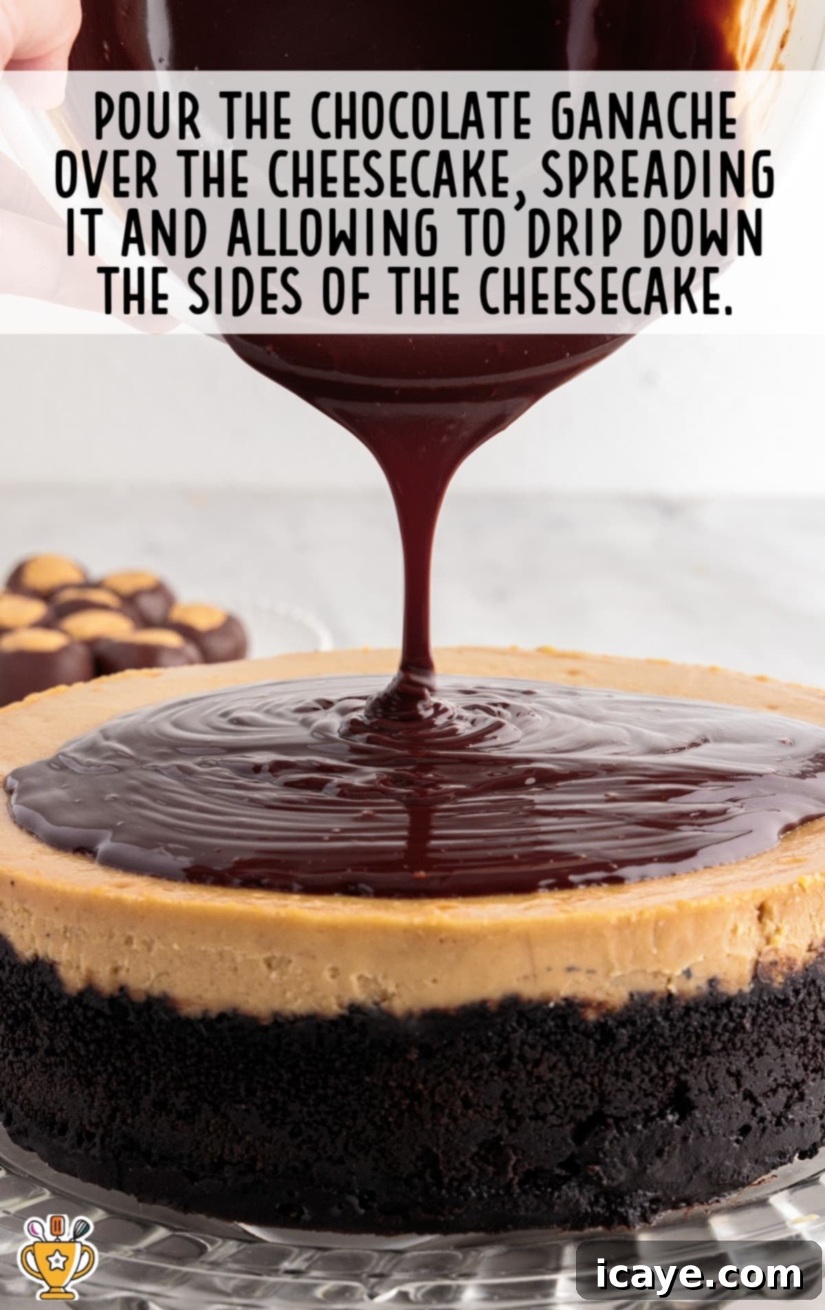 Rich, glossy chocolate ganache being poured and spread over the perfectly chilled surface of a Buckeye Cheesecake, with some ganache artfully dripping down the sides, creating an inviting and decadent appearance.